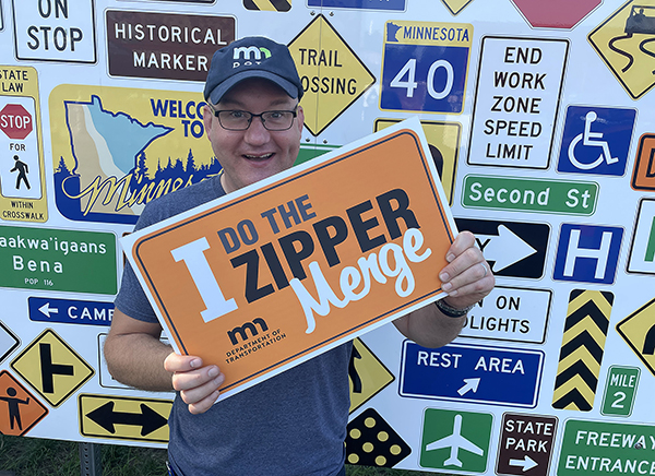 Photo of Joe Palmersheim in front of the selfie sign at the State Fair.
